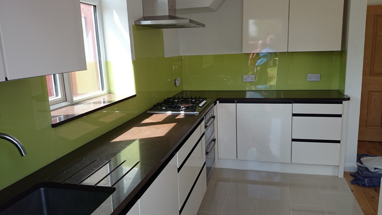 Lime green glass kitchen splashback installed by Carshalton glaziers
