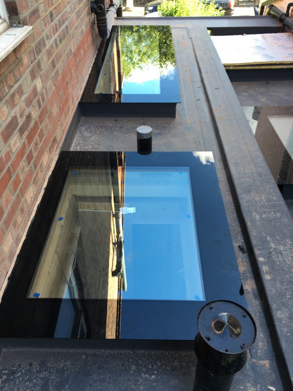 Multiple flat roof skylights on extension in Carshalton